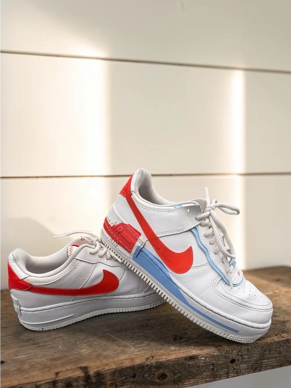 Nike Women’s White Sneakers with Orange Swoosh and Light Blue Accents
